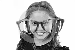 Kid happy wear cute eyeglasses accessory. Child charming smile isolated white background. Girl wear big funny eyeglasses