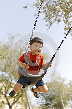 Kid having fun with swing