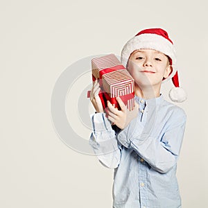 Kid holding Christmas Gift Box. Child Boy and Gift