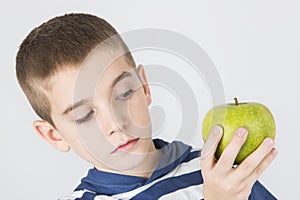 Kid holding green apple