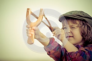 Kid holding slingshot