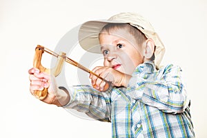 Kid holding slingshot in hands