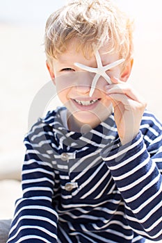 Kid holding starfish