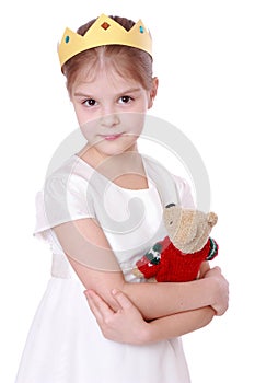 Kid holding teddy bear photo