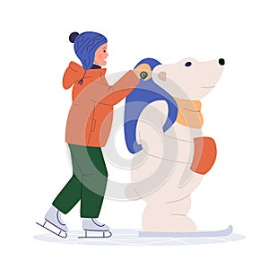 Kid ice skating with skating helper bear. Child skates training aid. Winter season sport activity for kids. Young girl in outdoor