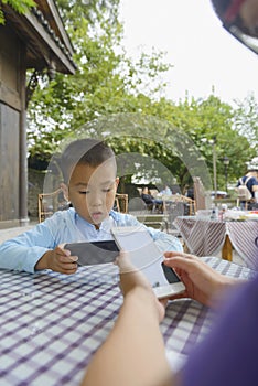 Kid indulge in smartphone