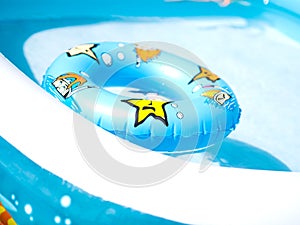 Kid inflate pool and swim ring photo