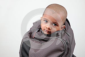A kid inside a bag
