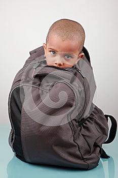A kid inside a bag