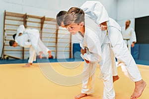 Kid judo, young fighters on training, self-defense