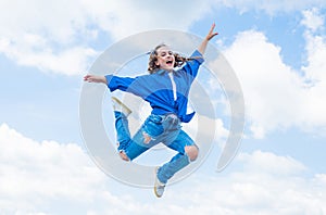 kid jump outdoor. kid fashion and beauty. sense of freedom. portrait of energetic child girl. concept of future. happy
