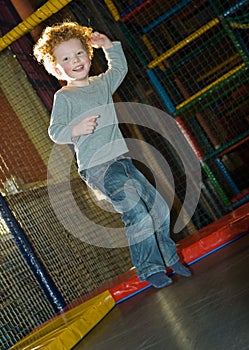 Kid jumping on trampoline