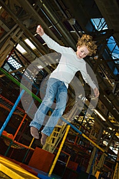 Kid jumping on trampoline