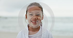 Kid, laugh and happy at beach in portrait while alone after training, practice or competition. Youth, girl or person