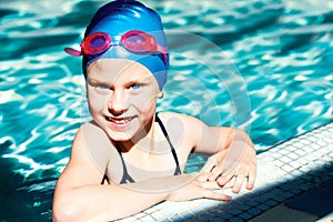 Kid laughing in a swimming pool