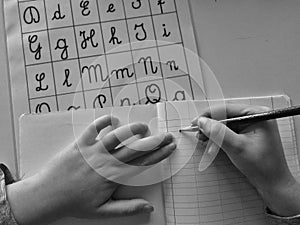 Kid learning cursive handwriting