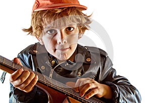 Kid learning to play guitar