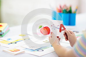 Kid learning to read. Phonics flash cards photo