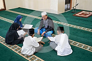 Kid learning to read quran