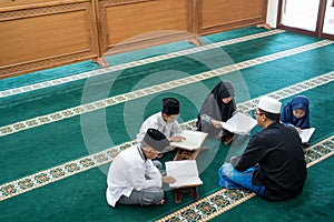 Kid learning to read quran