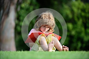 Kid learning to write, Preschool pupil education. Outdoor children education. Child distance learning using pencil to