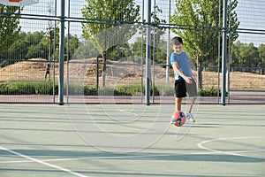 A kid with a leg prosthesis playing football