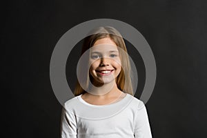 Kid model smiling with long healthy hair