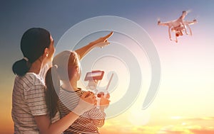 Kid and mom playing with drone