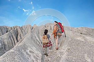 Kid and mom travel backpacks happy feeling freedom good and strong weight victorious facing on the grand canyon