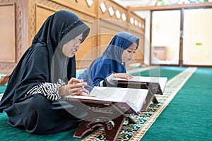 Kid muslim reading quran