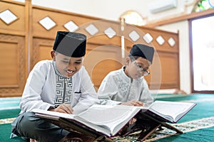 Kid muslim reading quran