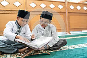 Kid muslim reading quran