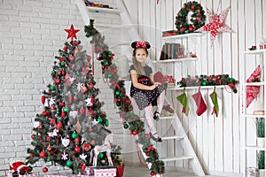 Kid near new-year tree