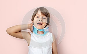 Kid accusing neck pain and wearing a cervical collar brace photo