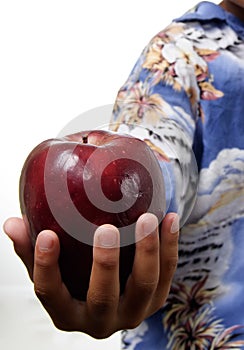 Kid offering apple