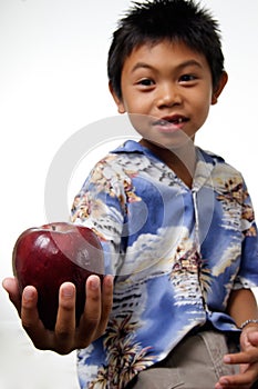 Kid offering apple