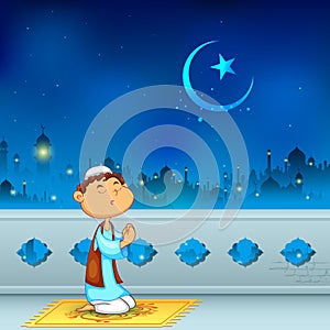 Kid offering namaaz for Eid celebration