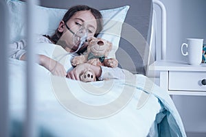 Kid with oxygen mask photo