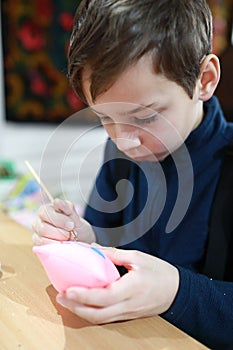 Kid painting stuffed toy