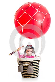 Kid with pilot hat and spyglass on hot air balloon