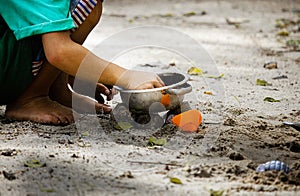 kid play sand in the park