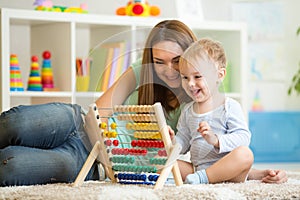Kid playing with abacus