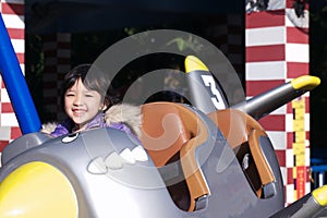 Kid playing in the amusement park