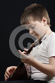 Kid playing balalaika