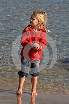 Kid playing at the beach