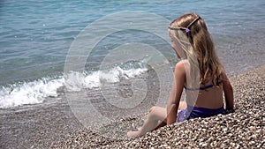 Kid Playing on Beach, Child Throwing Pebbles in Sea Waves on Seashore, Girl Plays Sunbathing on Coastline Shore in Summer Vacation