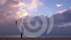 Kid Playing on Beach on Seashore, Child Flying Kite at Sunset on Ocean, Girl on Coastline in Summer Vacation Sea Waves at Sundown