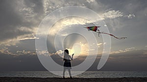Kid Playing on Beach on Seashore, Child Flying Kite at Sunset on Ocean,Girl on Coastline in Summer Vacation, Sea Waves at Sundown