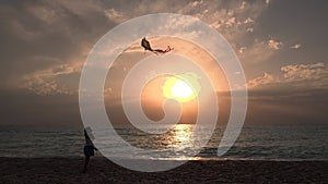 Kid Playing on Beach on Seashore, Child Flying Kite at Sunset on Ocean, Little Girl on Coastline in Summer Vacation