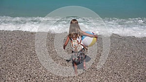 Kid Playing on Beach at Sunset, Happy Isolated Child with Beach Ball Walking in Sea Waves, Girl on Seaside in Summer Vacation